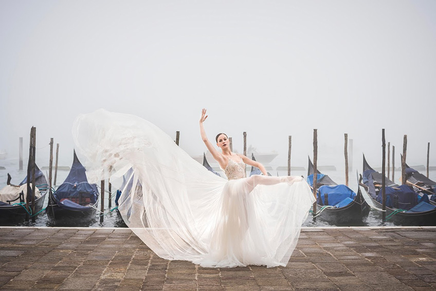 bride dancing in Venice wearing a Galia Lahav dress